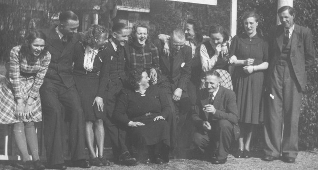 Group photo outside my grandparent's cafe. Grada, my dad, my mom, ??, Truus, Henk De Lange, Ada Wammes, Rie, Door De Lange, ? Vendrig My mother's father and mother in the foreground.